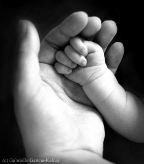 Image of mother and baby hands for article on postnatal depression counselling